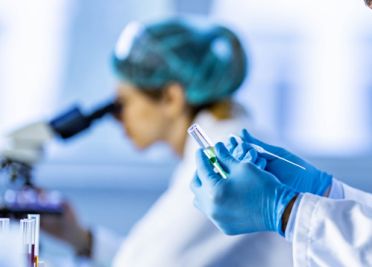 Science researcher examines samples