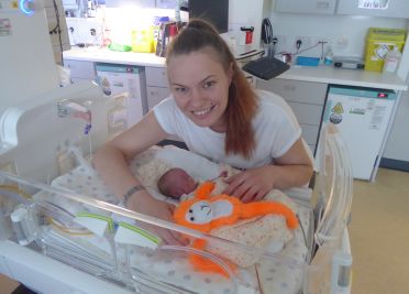 Mother and baby with the Babyleo incubator in the Neonatal Intensive Care Unit (NICU) 