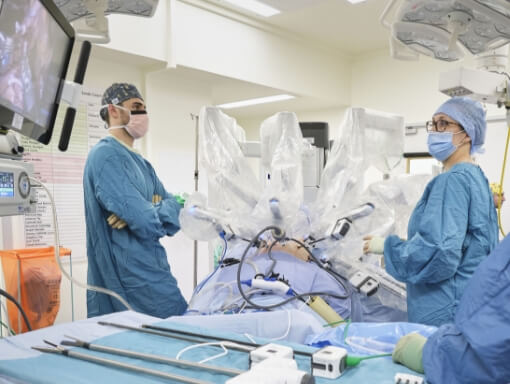 Two surgeons with surgical robot